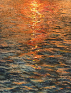 Rays of sunset light reflected on the water.
